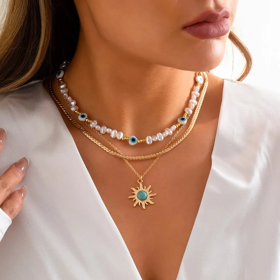 Set di Collane a Strati Parel & Occhio Maligno – Ciondolo Sole Boho