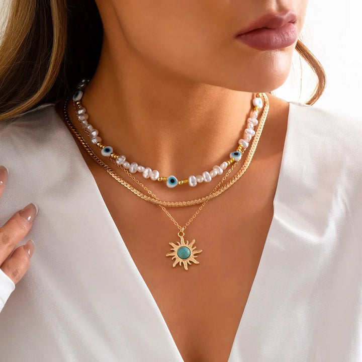 Set di Collane a Strati Parel & Occhio Maligno – Ciondolo Sole Boho